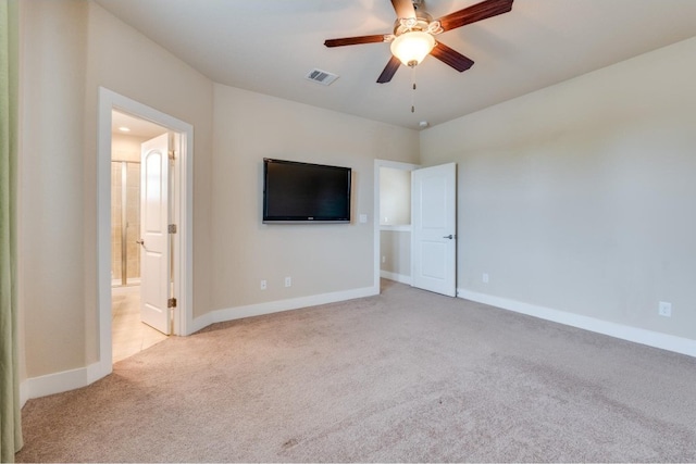 unfurnished bedroom featuring ceiling fan and light carpet