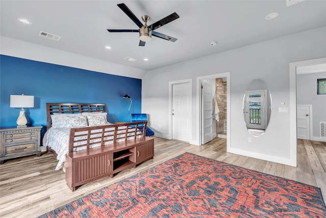 bedroom with connected bathroom, light hardwood / wood-style floors, and ceiling fan