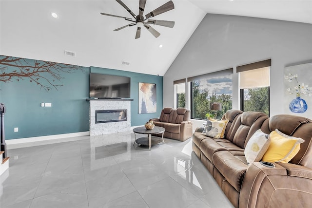 living room with high vaulted ceiling, ceiling fan, and a fireplace