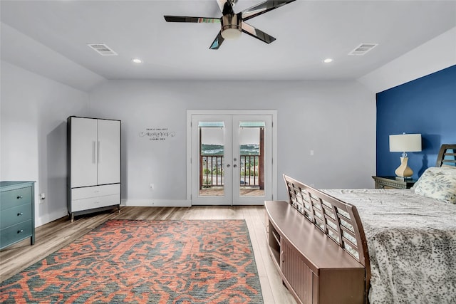 bedroom featuring ceiling fan, access to outside, light hardwood / wood-style floors, french doors, and vaulted ceiling