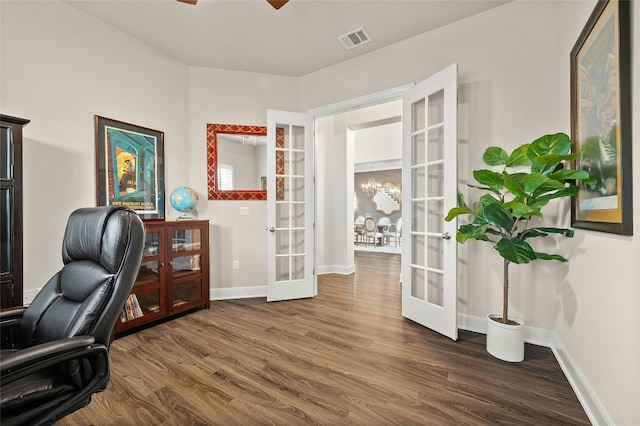 office area featuring french doors, dark hardwood / wood-style floors, and ceiling fan