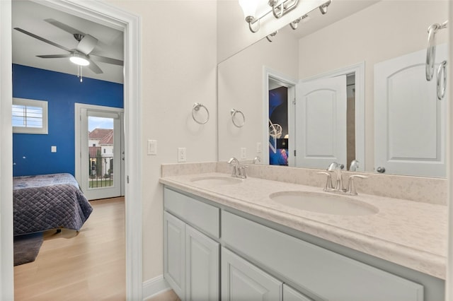 bathroom featuring wood-type flooring, ceiling fan, and vanity