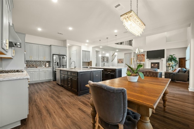 dining room featuring dark hardwood / wood-style floors and sink