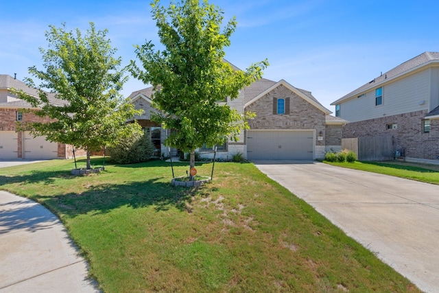 view of front of home featuring a front lawn and a garage