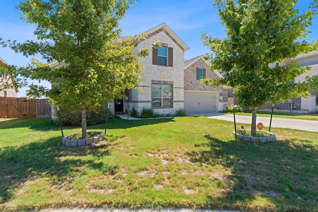 view of front of home featuring a front yard and a garage