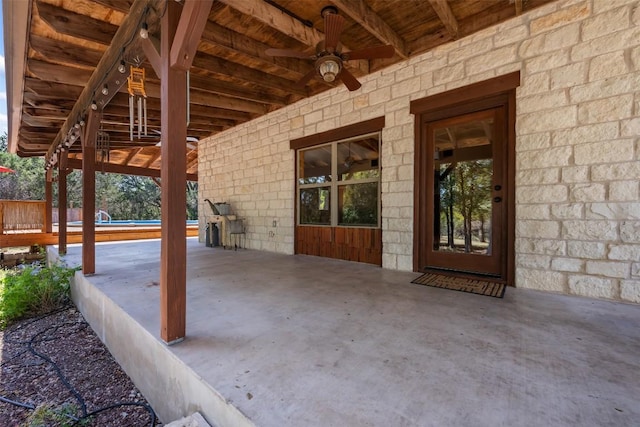 view of patio with ceiling fan