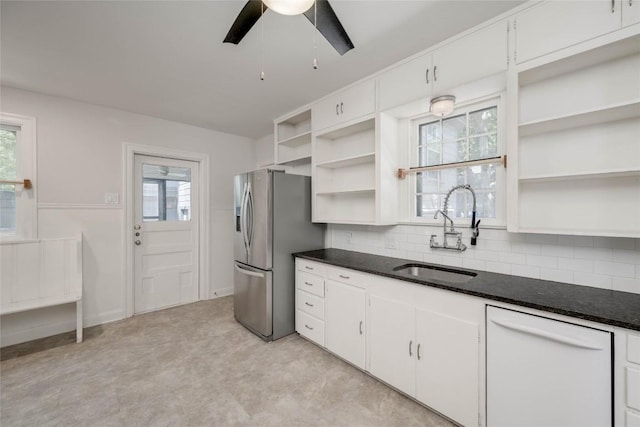 kitchen featuring open shelves, white cabinets, dishwasher, stainless steel refrigerator with ice dispenser, and a sink