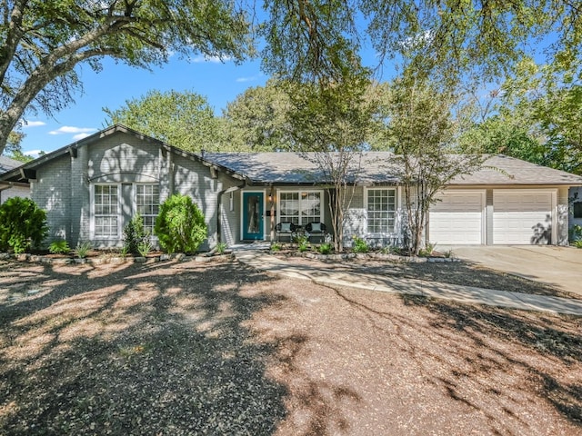 ranch-style home with a garage