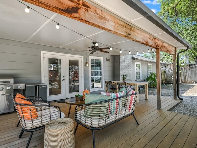 wooden deck featuring ceiling fan, a grill, an outdoor hangout area, and french doors