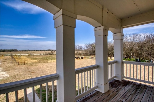 wooden terrace with a rural view