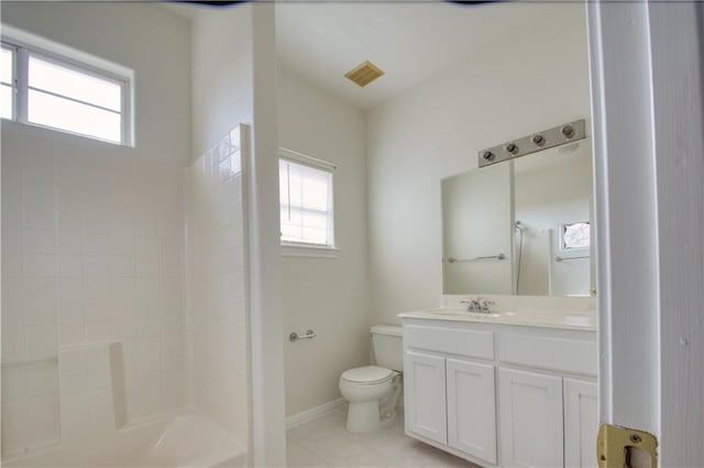 bathroom featuring vanity, tile patterned flooring, toilet, and a healthy amount of sunlight