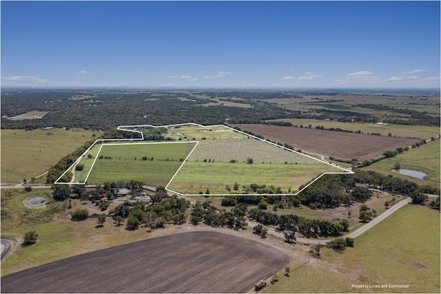 birds eye view of property with a rural view