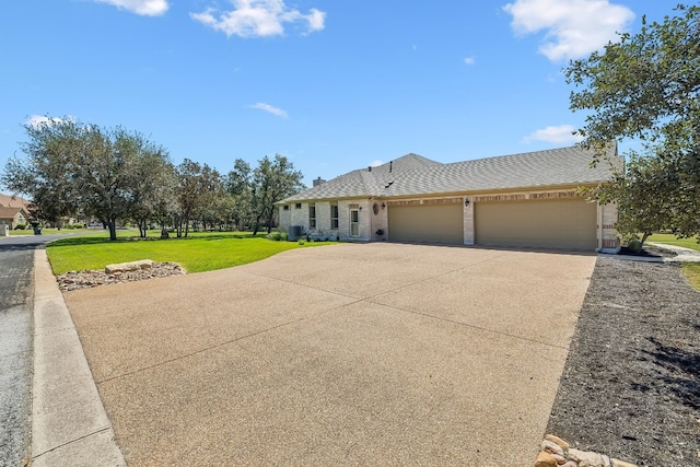 view of front of home with a front lawn and a garage