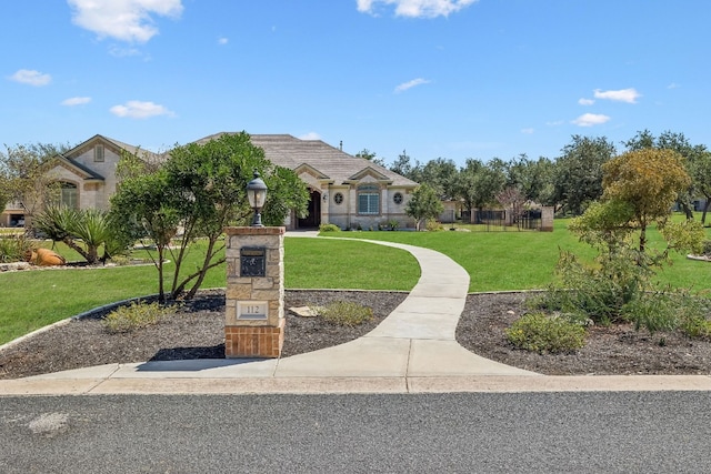 view of front of home with a front yard