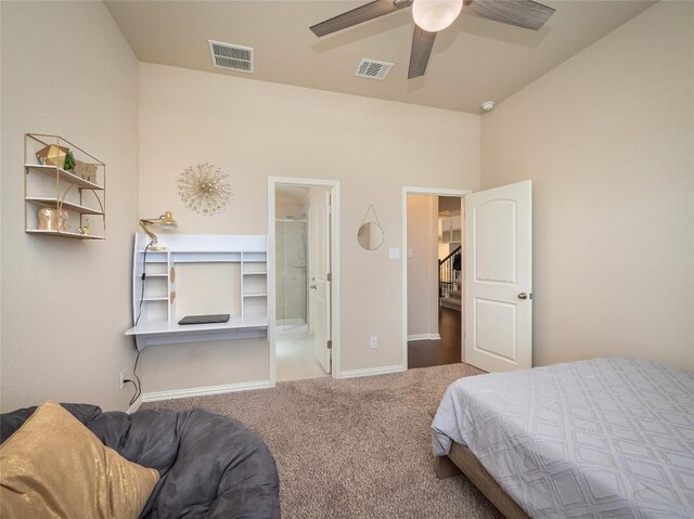 bedroom featuring carpet, ensuite bath, and ceiling fan