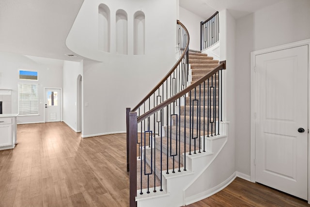 staircase featuring hardwood / wood-style flooring