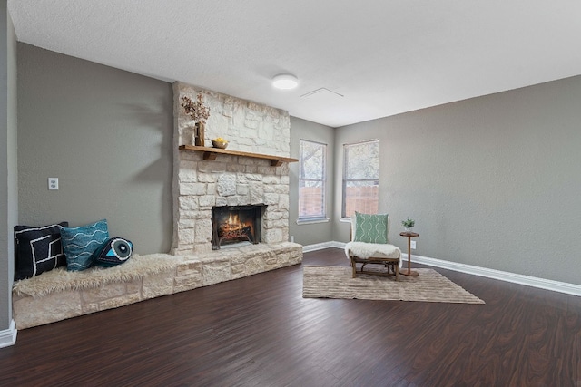 living area with a fireplace and hardwood / wood-style floors