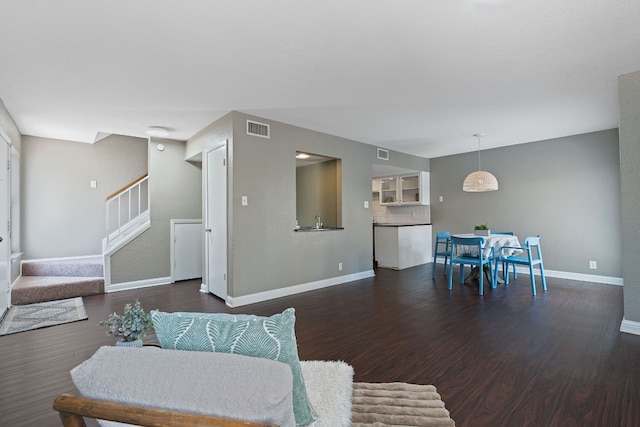 living room featuring dark hardwood / wood-style floors