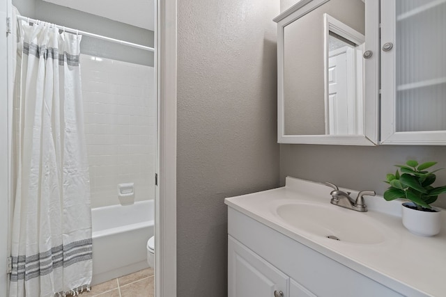 full bathroom featuring shower / bath combination with curtain, vanity, toilet, and tile patterned floors