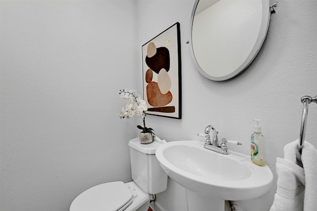 bathroom featuring a sink and toilet