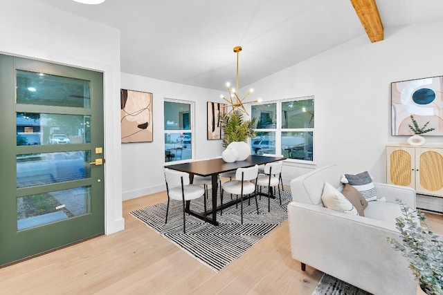 dining space with light hardwood / wood-style flooring, lofted ceiling with beams, and a notable chandelier