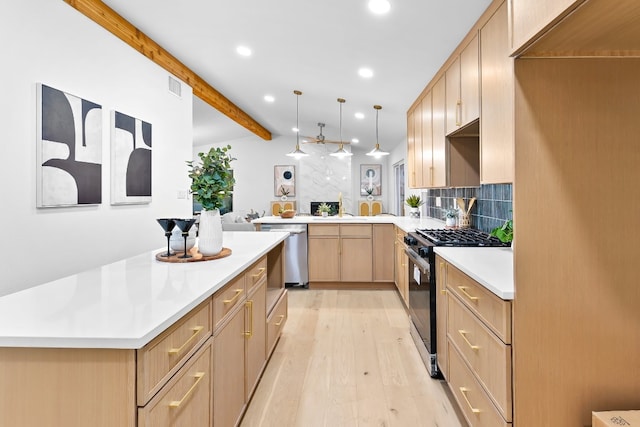 kitchen featuring backsplash, lofted ceiling with beams, light brown cabinetry, appliances with stainless steel finishes, and light hardwood / wood-style floors