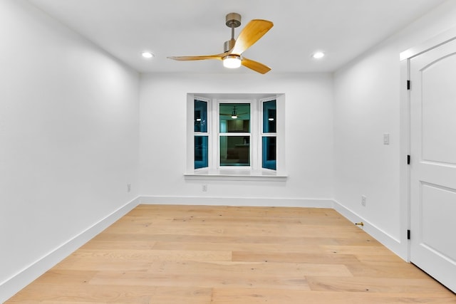 empty room featuring light hardwood / wood-style flooring and ceiling fan