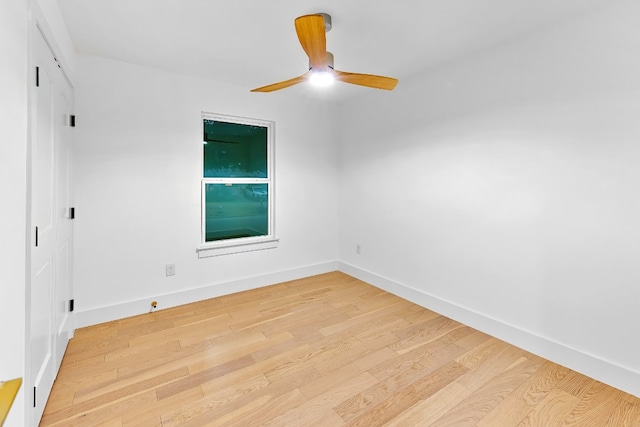 spare room featuring light hardwood / wood-style flooring and ceiling fan