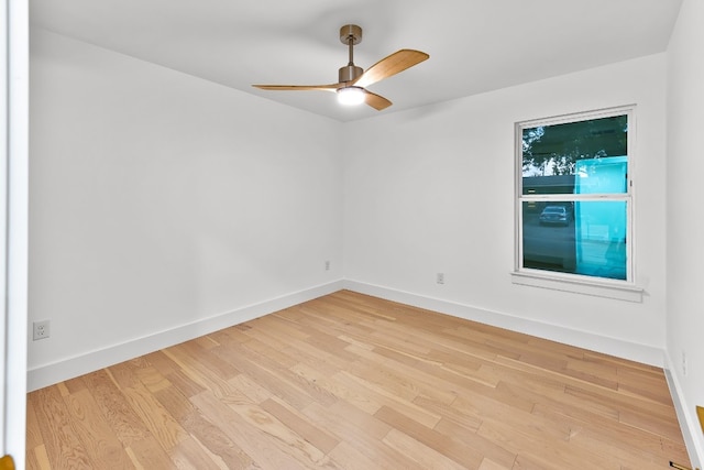 empty room with light hardwood / wood-style flooring and ceiling fan