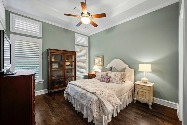 bedroom with ornamental molding, dark wood-type flooring, visible vents, and baseboards