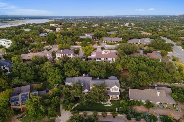 birds eye view of property featuring a water view and a residential view