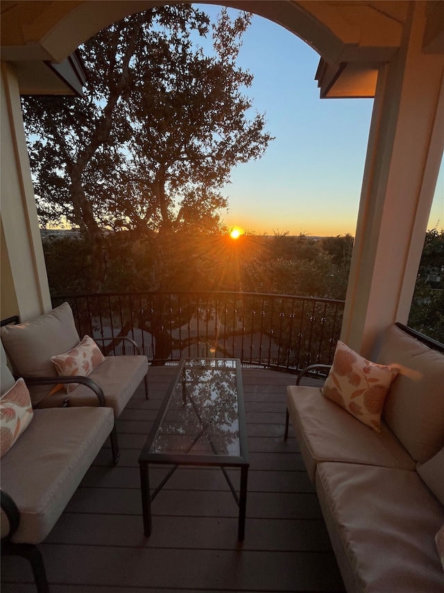 view of balcony at dusk