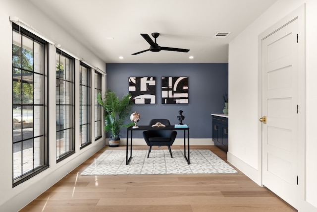 home office featuring ceiling fan and light wood-type flooring