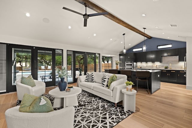 living room featuring high vaulted ceiling, french doors, ceiling fan, beamed ceiling, and light hardwood / wood-style floors