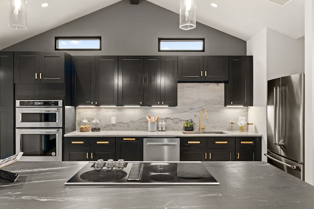 kitchen featuring beam ceiling, sink, high vaulted ceiling, backsplash, and appliances with stainless steel finishes