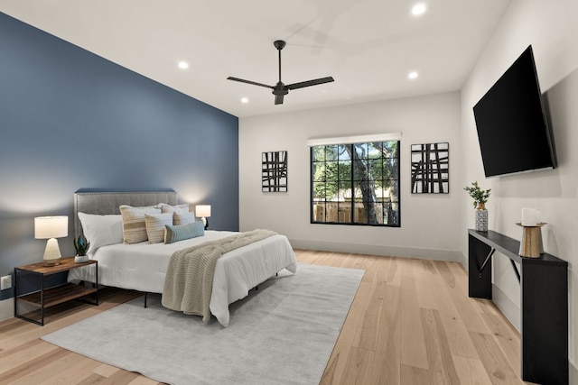 bedroom featuring light wood-type flooring and ceiling fan