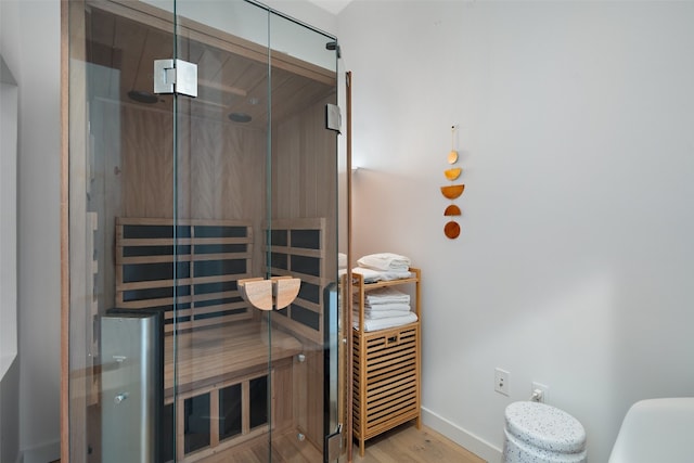 view of sauna featuring hardwood / wood-style floors