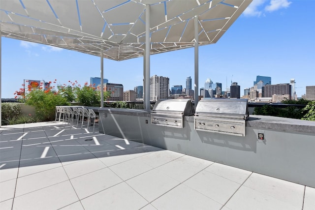 view of patio featuring an outdoor kitchen and area for grilling