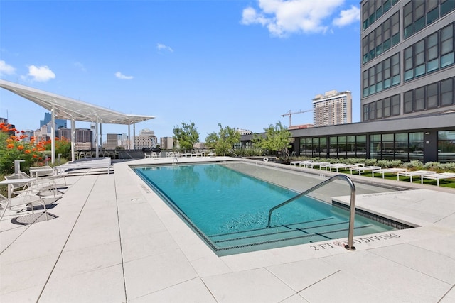 view of swimming pool with a patio area