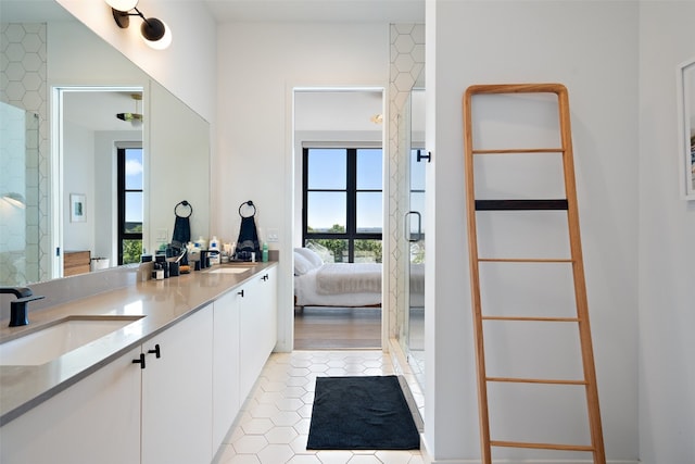 bathroom featuring tile patterned flooring and vanity