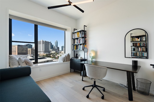 office area featuring ceiling fan and light wood-type flooring