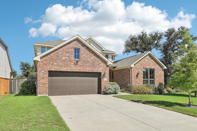 view of front property with a garage and a front yard