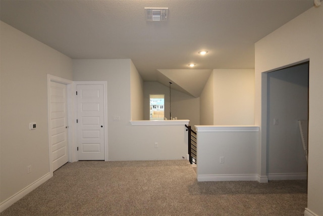 additional living space featuring carpet floors