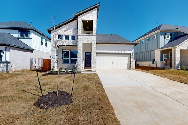 view of front of home with concrete driveway, an attached garage, stone siding, and a front lawn