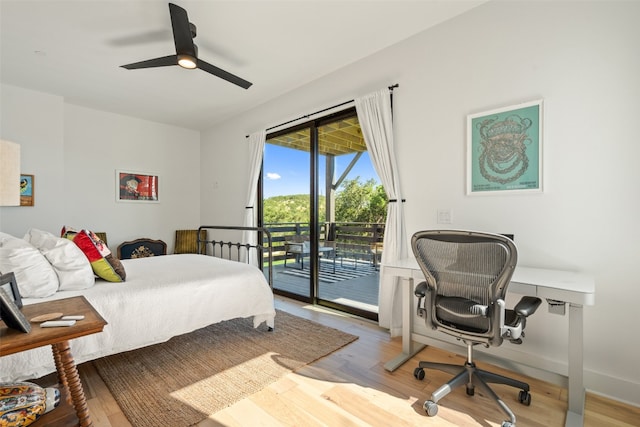 bedroom with light wood-type flooring, ceiling fan, and access to outside