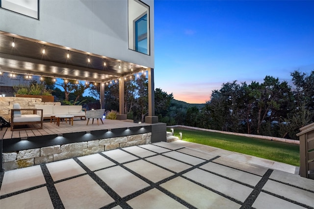 patio terrace at dusk with outdoor lounge area