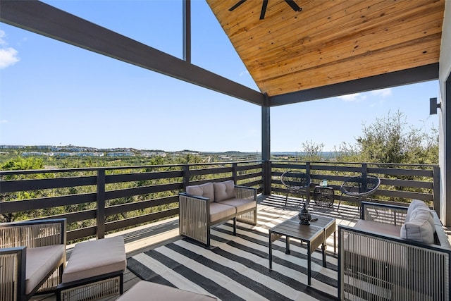 deck with an outdoor living space and ceiling fan