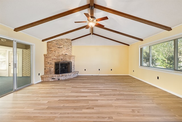 unfurnished living room with light hardwood / wood-style floors, vaulted ceiling with beams, a fireplace, and ceiling fan