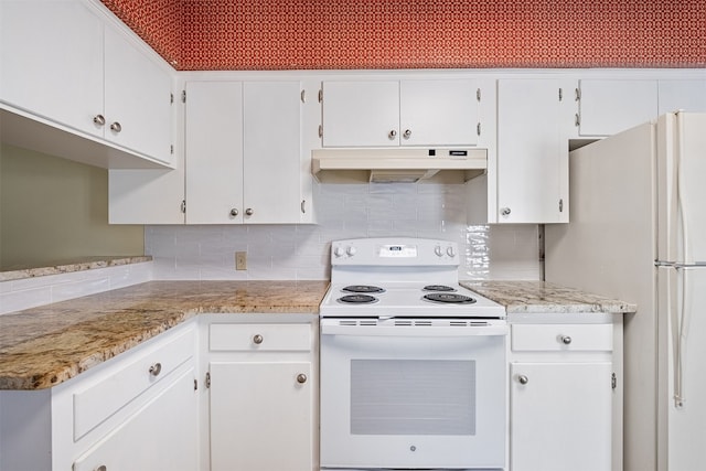 kitchen featuring white appliances, white cabinetry, and tasteful backsplash