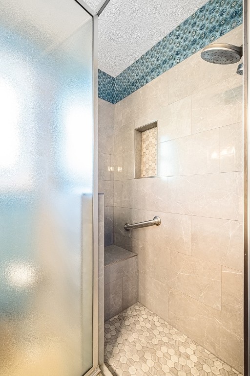 bathroom with tiled shower